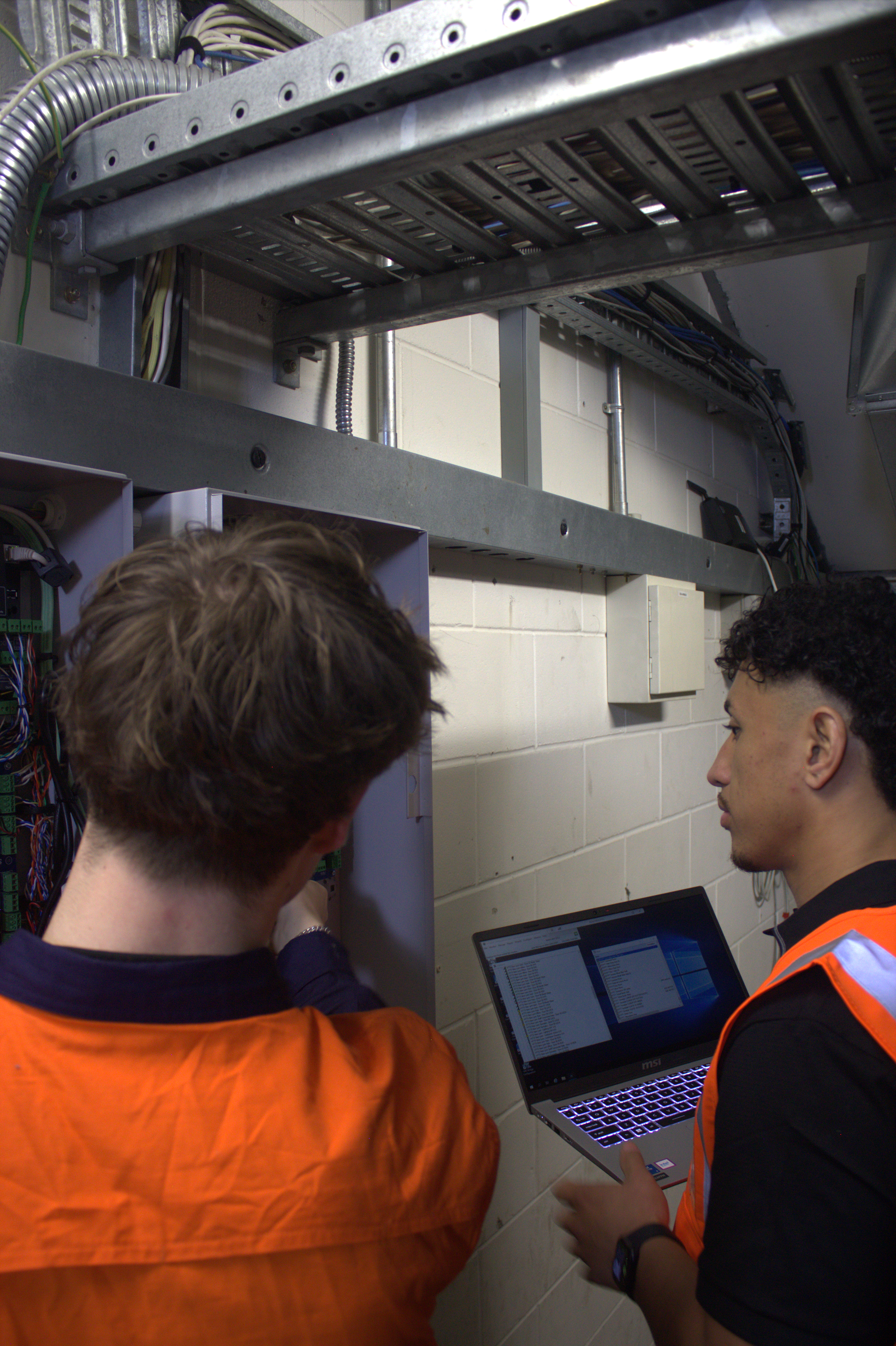 Technicians configuring and supporting systems on site