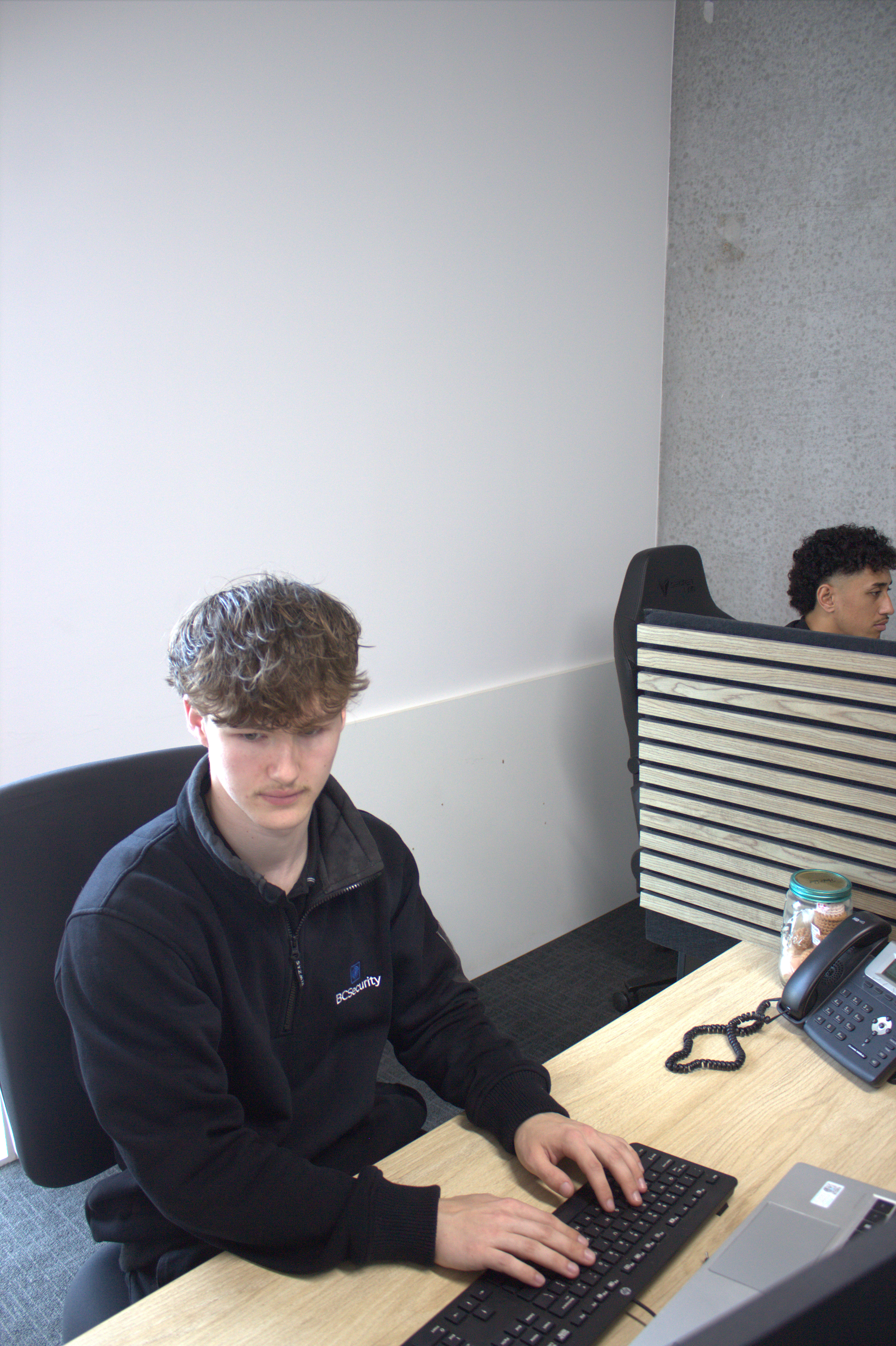 BC Security staff member working at a monitoring desk
