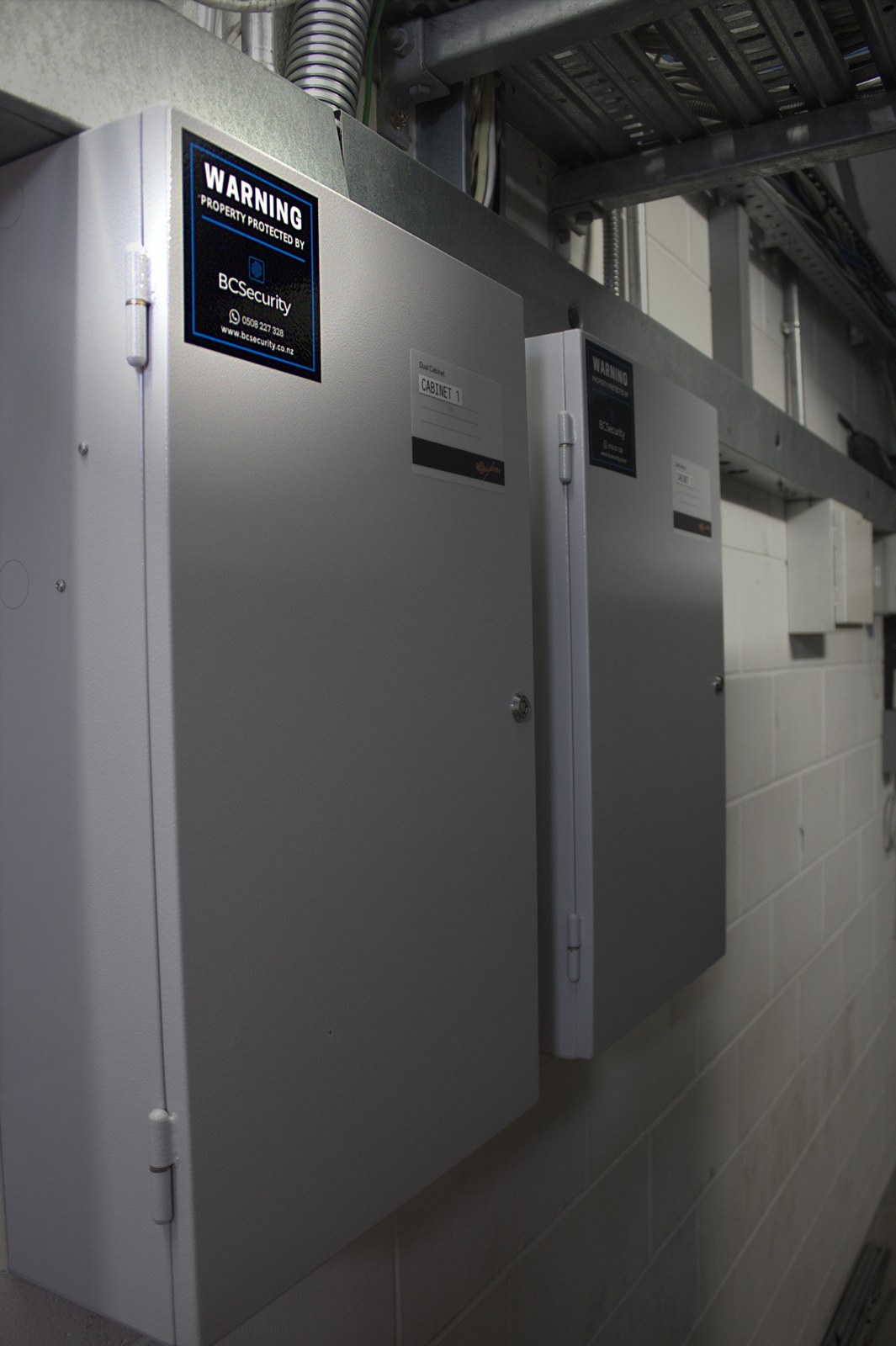 BC Security control cabinets with property protection warning labels